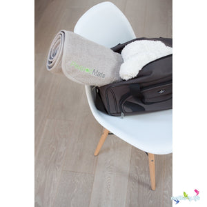 PeapodMats washable and reusable waterproof chair pad for bedwetting and incontinence, product illustration taupe rolled up in bag for travel