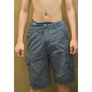 Young man wearing SOSecure Containment Swim Brief in Adult & Youth Style under swim trunks for incontinence protection